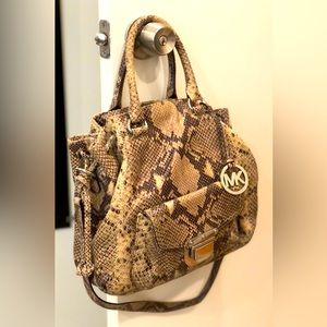 Michael Kors hobo handbag w/ handles & shoulder strap. Snap & drawstring closure